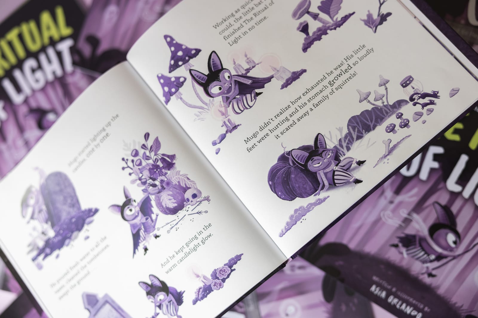 Détail du livre Mugo's Universe avec personnages et lettrages par Asia Orlando.